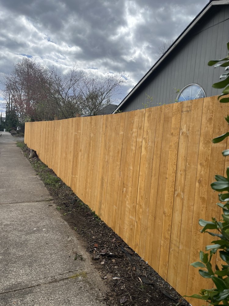 An image of a longer wooden fence.