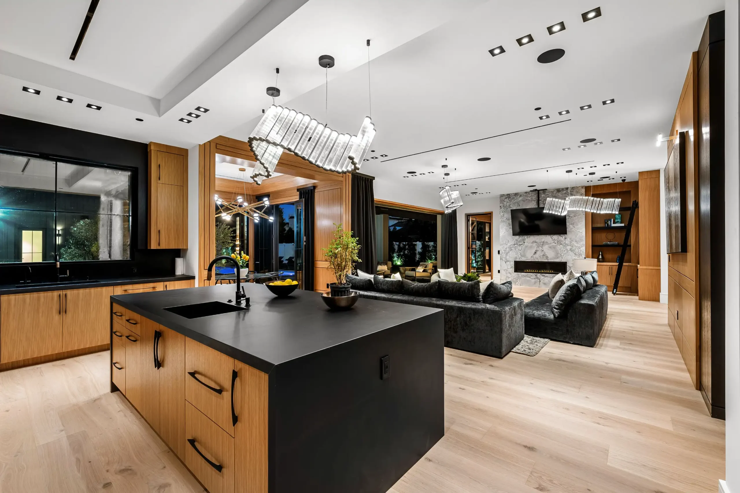 Open-concept kitchen and living room after home remodeling.